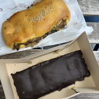 Chocolate-coated pastry with a curd on the outside and a mushroom slice  at Pastelaria Tupi in Porto