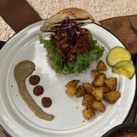Jackfruit burger with pickles on the side  at Liefs in Tulum