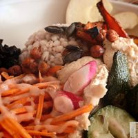 macrobiotic plate with barley, coral lentil dahl, braised and roasted vegetables, lacto-fermented marinated seaweed. at Prana Restaurant in Lyon