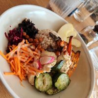 macrobiotic plate with barley, coral lentil dahl, braised and roasted vegetables, lacto-fermented marinated seaweed. at Prana Restaurant in Lyon