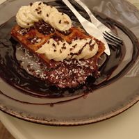 Belgian Waffles - chocolate/banana, alongside a cappuccino at Farm2Table - Davidshall in Malmo