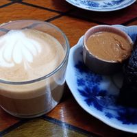 Oat milk cappuccino, chocolate banana bread with peanut butter. at Farm2Table - Davidshall in Malmo