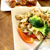 Drinking noodle and chixn wings  at Love Organic Cafe in West Hollywood