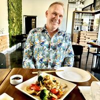 Handsome guy eating   at Love Organic Cafe in West Hollywood