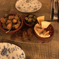 The starter was the highlight - vegan platter including popcorn cauliflower, olives, sweet corn fritters, hummus and relish!  at The Huntsman Inn in Holmfirth