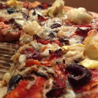 Staffies pizza with vegan cheese and olives - highly recommend! at Earth 'n' Sea in Byron Bay