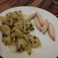 Papas aliñas, cooked potatoes with raw onion and herbs. We enjoyed every bite of it! at Kerkus Veggie Bar in Montecorto