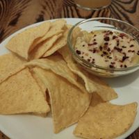 Lovely hummus with nachos. at Kerkus Veggie Bar in Montecorto