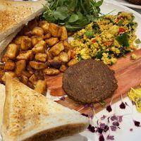 Omg. The scrambled tofu so buttery and savory. Must try! at Evviva in Toronto
