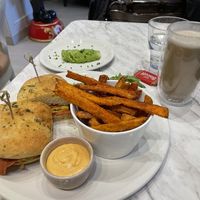 Just egg soy bacon tomato avo sandwich with sweet tater fries and oat espresso!  at Evviva in Toronto