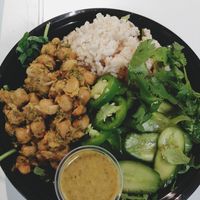 Create your own salad jerk chickpeas. Brown rice Jalapeno cilantro cucumbers house-made cilantro dressing at Infusedlife Plant Based Emporium in Minneapolis