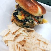 Housemade Vegetarian jerk Burger served with housemade tropical slaw at Infusedlife Plant Based Emporium in Minneapolis