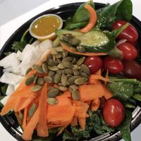 Create your own salad. This one has daikon cucumbers carrots. Pepitas tomatoes mixed greens house-made cilantro vinaigrette at Infusedlife Plant Based Emporium in Minneapolis