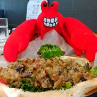 Krusty enjoying a Cheese steak in the Garden at The Plant Based & Juice Bar in Danville