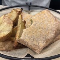 Crunch wrap with wedge fries  at The Plant Based & Juice Bar in Danville