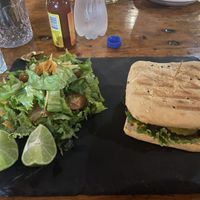 Black bean burger with salad instead of fries at Cafe Europa in Liberia