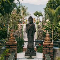 The buddha garden and lake views. at Buddha Cafe in Samosir