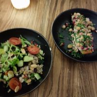 Couscous salad and a sweet potatoe topped with chickpea and pomegranate seeds at Livingstone in Copenhagen