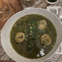 Dough balls filled with mushrooms in a veggie broth at Kubeh in New York City