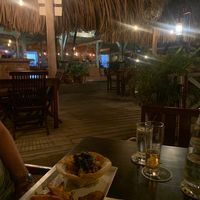 The restaurant. Harbor view with terrace on water on other side. at Tabooshh in Willemstad