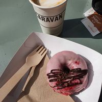 Vegan doughnut and a latte in a sunny day at Steam Yard in Sheffield
