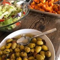Olives and sundried tomatoes, salad, oven baked sweet potatoes at Cafe Røed in Moss