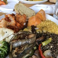 Cauliflower and carrot in tomato sauce, sweet potato, bulgur, lentils, grilled veggies and olives at Cafe Røed in Moss