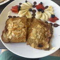 French toast
Oat bread, strawberries, blueberries, sliced almonds, banana, vanilla ice cream and syrup.  at Cafe Central Traveler's Coffee in Cartagena