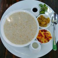 Oatmeal on the water with fruits and honey at Green Queen Cafe  in Mui Ne