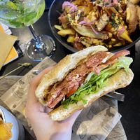 “Amazing vegan burger” & “Devil’s soy” loaded fries 😋  at Pisek Bar in Celje