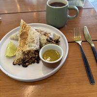 Breakfast burrito and coffee which I took with coconut milk  #Veganuary at Herbivoro in Cancun