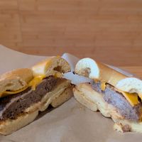 sourdough bagel with vegan cheese, sausage, and egg at Seize the Bagel in Vancouver