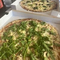 The vegan and a custom pizza with vegan cheese   at Pizza 44 in Setubal