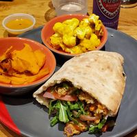 Veggie burger pita, charred sweet potato, tumeric cauliflower at Nandos Peri Peri in Oak Brook