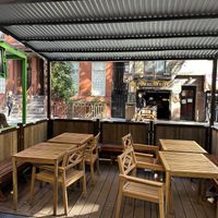 Covered outdoor seating  at Mamoun's Falafel - Greenwich Village in New York City