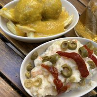 Albondigas in an almond sauce and ensaladilla rusa. 2,5 euros each! at La Vegana Taperia in Malaga