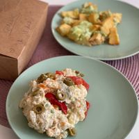 Ensaladilla rusa y patatas con alioli 💚 at La Vegana Taperia in Malaga