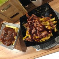 Patatas con vegan cheese and albondigas at La Vegana Taperia in Malaga