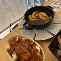 Patatas bravas y gambas al pil pil  at La Vegana Taperia in Malaga