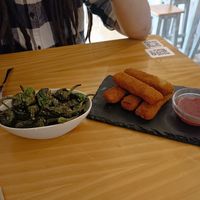 Pimientos de padrón y fingers de queso at La Vegana Taperia in Malaga
