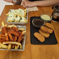 Absolute disappointment of "patatas". These are just soggy fries. at La Vegana Taperia in Malaga