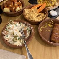russian salad, cheese sticks, humus, tortillaas  at La Vegana Taperia in Malaga