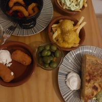 Olives, patatas aioli, meatballs with almond sauce, croquetas del dia, tortilla de patatas at La Vegana Taperia in Malaga