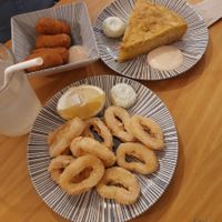 Calamares, tortilla de patatas, croquetas del día at La Vegana Taperia in Malaga