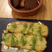Tortilla with a very garlicky sauce at La Vegana Taperia in Malaga