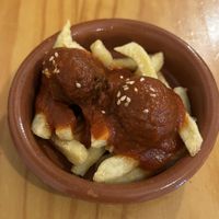 fries with “meat"balls in tomato sauce   at La Vegana Taperia in Malaga