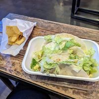 Three tacos with potatoes, pinto beans, green Chile, Chile corn, guacamole, and lettuce. at Illegal Pete's in Tucson