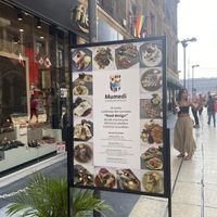Mumedi Outdoor Sign w/Zócalo in Background  at Mumedi in Mexico City