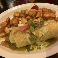 burrito with green sauce and potatoes  at Carlos 'N Charlie's in Las Vegas