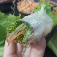 Rolling all the ingredients in rice paper at Thuy Di Quan My Quang in Ha Giang